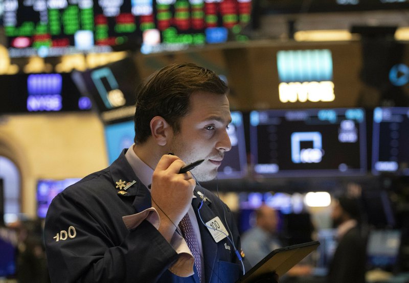 In this July 5, 2019, file photo trader Benjamin Tuchman works at the New York Stock Exchange in New York.  (AP Photo/Mark Lennihan, File)