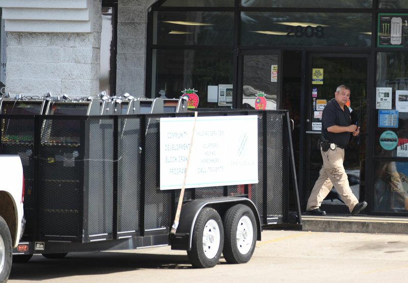 NWA Democrat-Gazette/DAVID GOTTSCHALK Casino-style slot and gambling machines are loaded Thursday into a Springdale trailer in the parking area of Kings Korner, 2808 W. Huntsville Ave., in Springdale. Police searched Kings Korner and Kings Xpress, 2513 N. Thompson. Police said both locations were operating gambling houses, in violation of Arkansas Law.