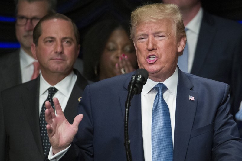 President Donald Trump speaks about kidney health at the Ronald Reagan Building and International Trade Center, accompanied by Health and Human Services Secretary Alex Azar, left, Wednesday, July 10, 2019, in Washington. (AP Photo/Alex Brandon)