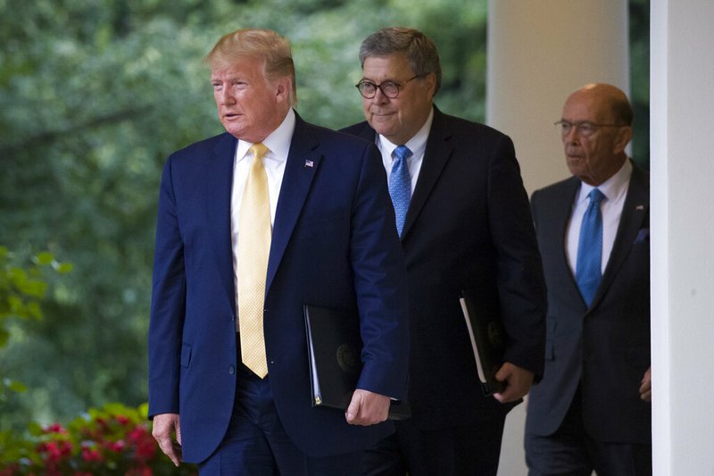 President Donald Trump, followed by Attorney General William Barr and Commerce Secretary Wilbur Ross, arrives Thursday at the White House Rose Garden. Trump said his political opponents were “trying to erase the very existence of a very important word and a very important thing, citizenship.” 