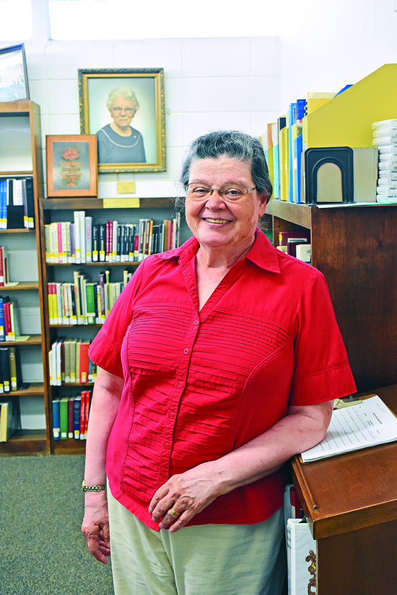 JoyLynn Edwards of Searcy stands in the Arkansas Room at the Searcy Public Library. Edwards has volunteered more than 500 hours at the library in the past three years, following her retirement from Unity Health, where she was a clinical laboratory scientist.