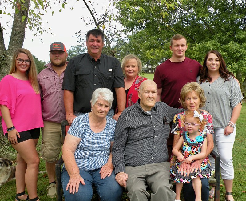 Johnny Wayne Taylor, standing, third from left, and his wife, Jennifer Taylor, fourth from left, own and operate J&J Taylor Farms in McCrory. They are the 2019 Woodruff County Farm Family of the Year. Family members include, seated, from left, Alta and Eddie Taylor and Marlene McDonald, holding 3-year-old Lanie Paige McElyea; and standing, Morgan Simmons, Zac McDonald, Melanie McElyea and Caleb McElyea.