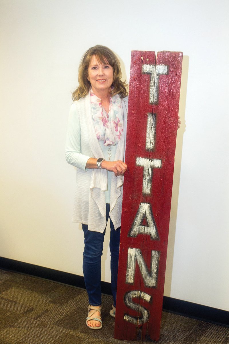 Marye Jane Brockinton holds a Titans sign at the Jacksonville North Pulaski School District Central Office. Brockinton, who worked in education for 16 years, retired at the end of the 2018-19 school year. She was an assistant principal at Jacksonville High School for the past three years.