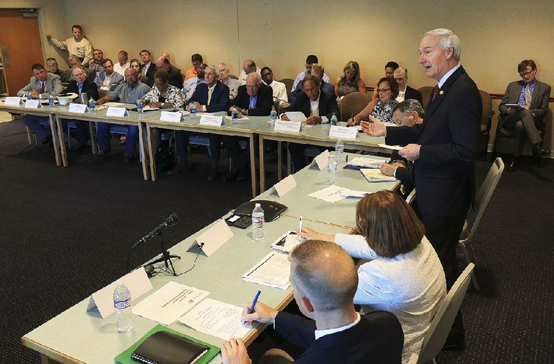 FILE — Gov. Asa Hutchinson speaks during the first meeting of the Arkansas Levee Task Force that he established after spring 2019's historic flooding in Arkansas.