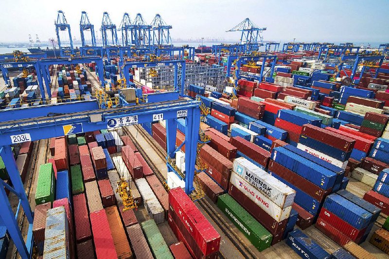 Containers are piled up in May at a port in Qingdao, China, as China and the U.S. continued a standoff over trade, with the sides taking turns imposing tariffs. 