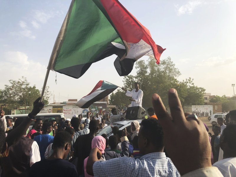 Sudanese people celebrate in the streets of Khartoum after ruling generals and protest leaders announced they have reached an agreement on the disputed issue of a new governing body on Friday, July 5, 2019.  The deal raised hopes it will end a three-month political crisis that paralyzed the country and led to a violent crackdown that killed scores of protesters. (AP Photo)