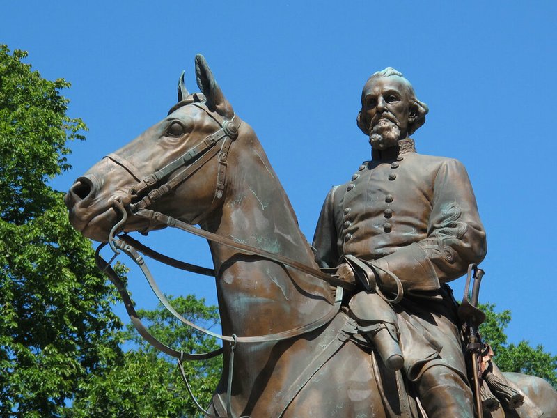 In this Aug. 18, 2017, file photo, a statue of Confederate Gen. Nathan Bedford Forrest sits in a park in Memphis, Tenn. Republican Tennessee Gov. Bill Lee is facing backlash for signing a proclamation ordering a day to honor Forrest, an early leader of the Ku Klux Klan. Lee told reporters this week that a 1969 state law required him to sign the proclamation but declined to say whether he believed the law should be repealed. The proclamation designates July 13 as "Nathan Bedford Forrest Day." Forrest was a Confederate cavalry general who had amassed a fortune as a plantation owner and slave trader in Memphis before the Civil War. (AP Photo/Adrian Sainz, File)
