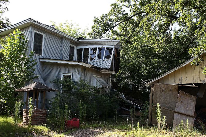 This house on Poplar Street in Pine Bluff is one of an estimated 600 that the Urban Renewal Agency was working to remove within the next five years. 