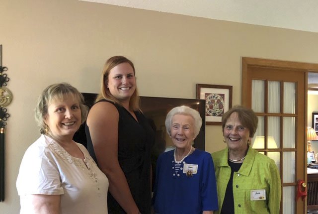 Courtesy photo Chelsea Kross (second from left), recipient of the PEO Scholar Award, is congratulated by Arkansas Chapter A PEO members Kathy Manley (from left), Jean Razer and Ann Ferrell. Kross will use the $15,000 award to continue her study of environmental change: implications for the development of the crayfish frog. She is currently enrolled in a Ph.D program at the University of Arkansas.