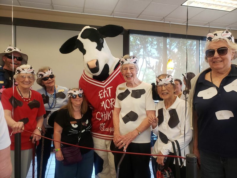 Courtesy photo Residents of Holiday Retirement in Springdale took the challenge and dressed up as cows when Chick-fil-A offered free food in honor of cow appreciation day.