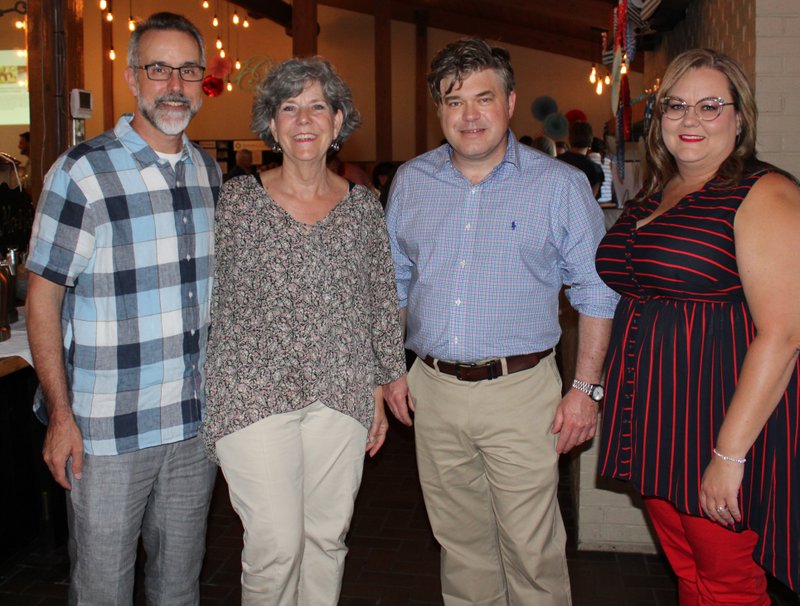 NWA Democrat-Gazette/CARIN SCHOPPMEYER Tim Hudson and Charlotte Taylor (from left), Jason Hurt and Heather Bailey attend Red, White and Baby Blue.