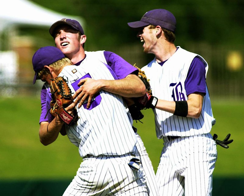 Arkansas Democrat-Gazette/MICHAEL WOODS Boonville pitcher Trey Holloway is congratulated by teammates Will Swint (left) and Brad West (right) after beating the Central Arkansas Christian Mustangs 2-1 in the 2001 Class AAA state championship game in Fayetteville.