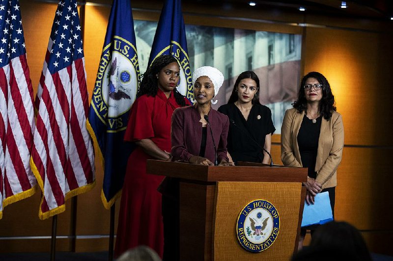 Democratic Reps. Ayanna Pressley (from left), Ilhan Omar, Alexandria Ocasio-Cortez and Rashida Tlaib hold a news conference Monday on Capitol Hill to address President Donald Trump’s comments. 