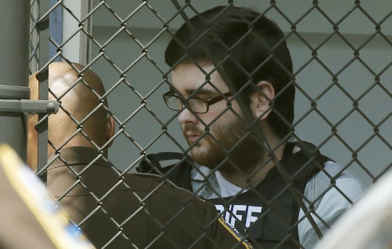 James Alex Fields Jr., is led out of General District Court courthouse after his sentencing on state charges, Monday, July 15, 2019, in Charlottesville, Va. Fields, an avowed white supremacist, was sentenced to life plus 419 years on state charges for deliberately driving his car into anti-racism protesters during a white nationalist rally in Virginia. Last month, Fields received a life sentence on 29 federal hate crime charges. (AP Photo/Steve Helber)