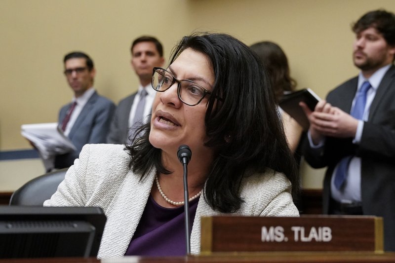 FILE - In this Feb. 26, 2019 file photo, U.S. Rep. Rashida Tlaib, D-Mich., listens during a House Oversight and Reform Committee meeting, on Capitol Hill in Washington. A relative of Tlaib living in the West Bank says President Donald Trump is an anti-Palestinian racist. Tlaib, a Michigan Democrat and daughter of Palestinian immigrants, was one of four congresswomen of color who were targeted in Trump&#x2019;s latest Twitter barrage. (AP Photo/J. Scott Applewhite, File)