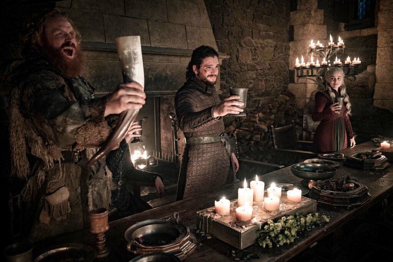 This image released by HBO shows Kristofer Hivju, from left, Kit Harington and Emilia Clarke in a scene from "Game of Thrones." "Game of Thrones," "Veep" and "The Big Bang Theory," three major series that wrapped last season, will find out with Tuesday's nominations if they have one more chance at Emmy gold. (Helen Sloan/HBO via AP)