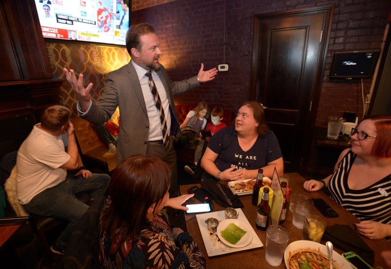 Josh Mahony, Democratic candidate for Arkansas' 3rd Congressional District, speaks Tuesday, Nov. 6, 2018, with visitors during a watch party for the Washington County Democratic Party of Arkansas at Farrell's Lounge in Fayetteville.