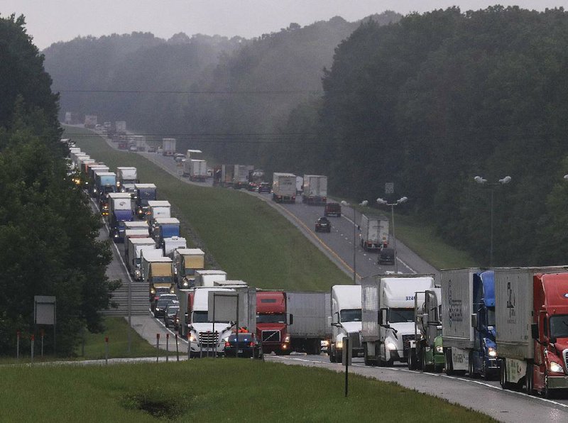 Traffic backs up Tuesday on Interstate 30 in Arkadelphia after high water forced the closing of parts of I-30 west of the city. 