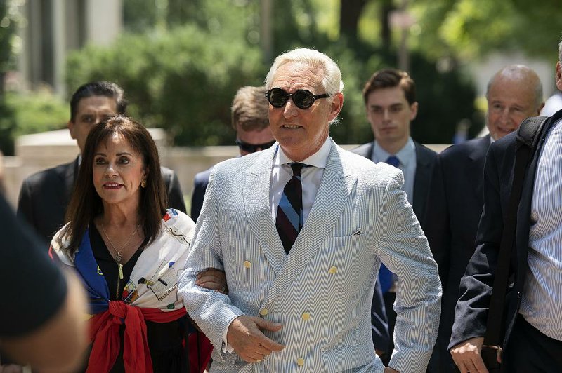 Roger Stone, a longtime confidant of President Donald Trump, and his wife, Nydia Stone, leave federal court Tuesday in Washington. 