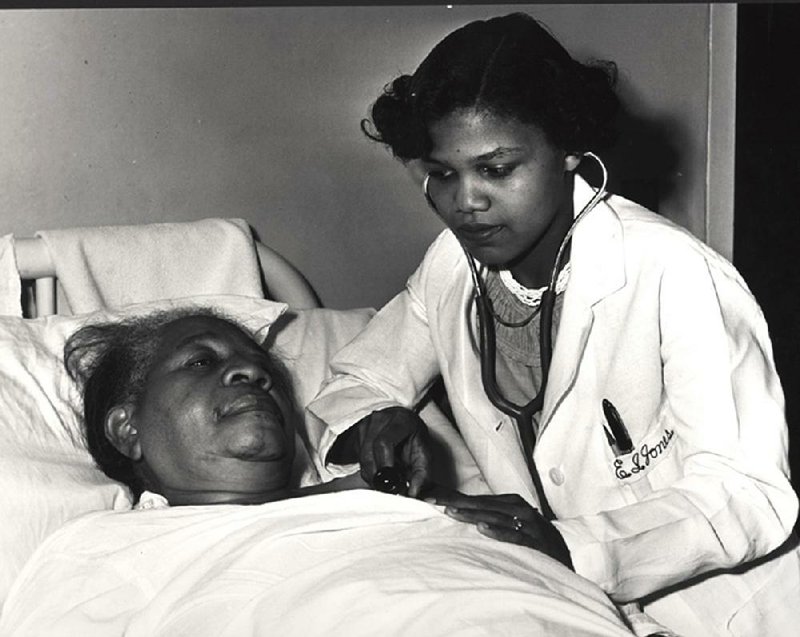 Dr. Edith Irby Jones, the first black person to graduate from a previously all-white medical school in the South, tends to a woman in Houston, Texas. 