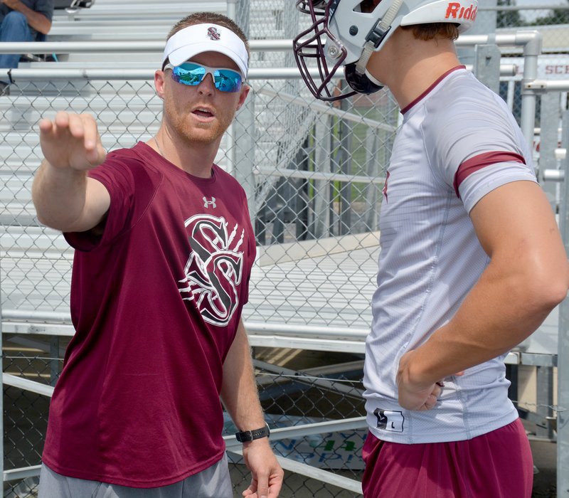 Graham Thomas/Herald-Leader First-year Siloam Springs assistant football coach Michael Smith gives instructions to outside linebacker Camden Collins last Friday during the Southwest Elite 7 on 7 Showcase at Shiloh Christian in Springdale.