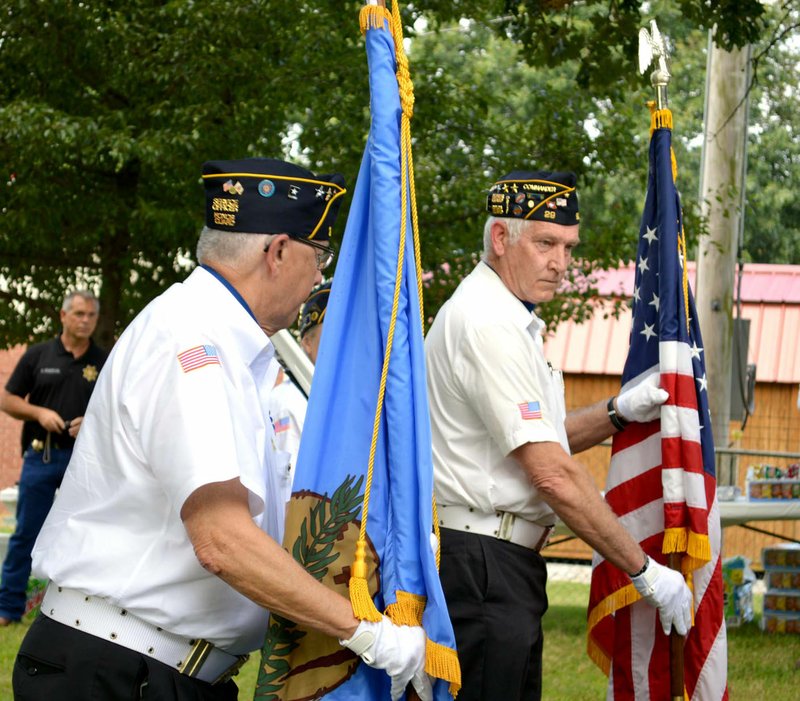 Sierra Bush/Herald-Leader Members of Siloam Springs American Legion Post 29 post the colors and begin festivities for West Siloam Springs' 50th anniversary celebration Saturday at Cedar Park.