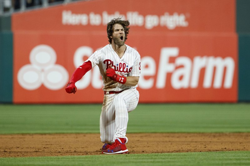 Philadelphia Phillies' Bryce Harper celebrates after hitting a game-winning two-run double off Los Angeles Dodgers relief pitcher Kenley Jansen during the ninth inning of a baseball game Tuesday, July 16, 2019, in Philadelphia. Philadelphia won 9-8. (AP Photo/Matt Slocum)