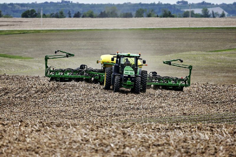 A farmer plants soybeans in May near Springfield, Neb. The U.S. trade war with likely mean that China will forever reduce its purchases of U.S. soybeans, experts say. 
