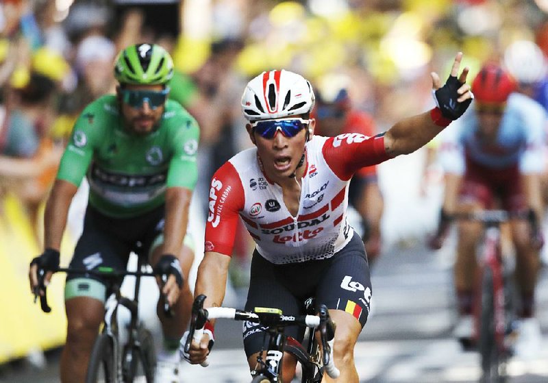 Australia’s Caleb Ewan (middle) celebrates as he crosses the finish line Wednesday to win the 11th stage of the Tour de France in Toulouse, France. 