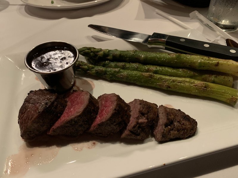 Roasted tenderloin with bordelaise sauce comes with a side of asparagus at Bone's Chophouse in the Village at Rahling Road. Arkansas Democrat-Gazette/Eric E. Harrison
