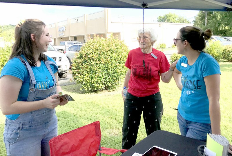 Sally Carroll/McDonald County Press Sarah Fore, Janice Bearbower and Amy Wallain share a laugh while talking at the Noel First Friday event. Wallain, who serves as McDonald County Library director, said Fore is helping this summer, thanks to a grant. Bearbower, a McDonald County Chamber representative, said the chamber has been very busy recently celebrating several ribbon-cutting ceremonies.