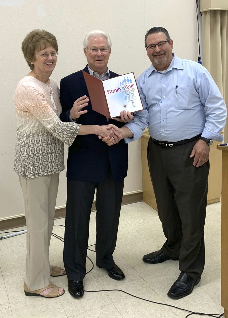 Courtesy photo Carl and Joan Long received St. Bernard Council 9514's Knights of Columbus Family of the Year Award on May 19 from Deputy Grand Knight Mike Young in the St. Bernard Parish Hall. The Longs are active in the Knights of Columbus Council and 4th Degree Assembly functions. Carl is active in council events, regularly attends council meetings and serves as an officer in the 4th degree. Joan is active in the St. Bernard Women's Organization and uses her crafting skills to create works of seasonal art many designed with whimsey. Carl uses his wood crafting skills to keep the kitchen drawers functional, builds merchandising props for display of the women's organization's finished crafts at the holiday bazaar.