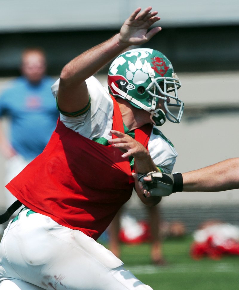 June 22, 2005: West all star end Ryan Evans scrambles around the corner during practice in Fayetteville.