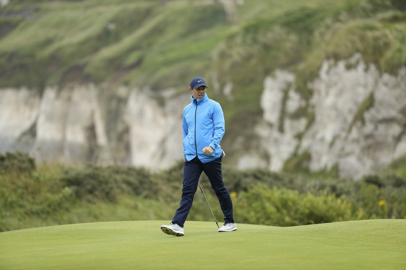 Northern Ireland's Rory McIlroy walks across the 5th green during a practice round ahead of the start of the British Open golf championships at Royal Portrush in Northern Ireland, Wednesday, July 17, 2019. The British Open starts Thursday. (AP Photo/Peter Morrison)