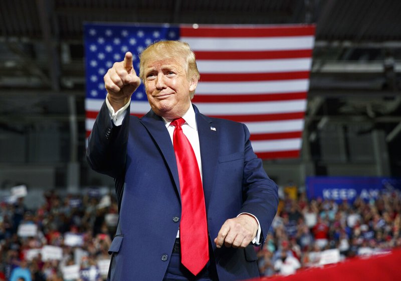 President Donald Trump gestures to the crowd as he arrives to speak at a campaign rally at Williams Arena in Greenville, N.C., Wednesday, July 17, 2019. (AP Photo/Carolyn Kaster)