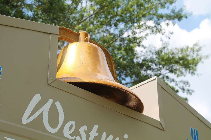 The bell that once hung in the bell tower at Little Rock’s Westminster Presbyterian Church now rests atop the church’s electronic marquee sign at the curb of its new location on Arch Street Pike, in the city's Landmark community. During the fire that destroyed the church on July 19, 2018, it fell from the tower and sustained the crack visible through the sandblasting and coating it’s since received. 