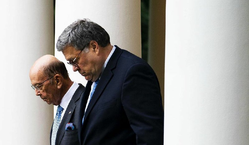 Commerce Secretary Wilbur Ross (left) and Attorney General William Barr, shown at the White House on July 11, were found in contempt of Congress by the House on Wednesday over their failure to comply with subpoenas on efforts to place a citizenship question on the 2020 census. 