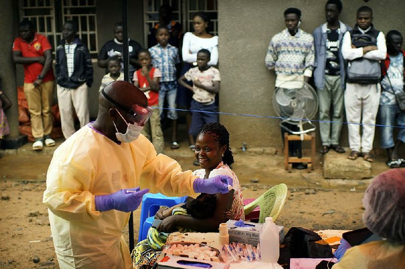 A health worker vaccinates a child against ebola recently in Beni, Congo. The country is dealing with the second-worst ebola outbreak in history. 
