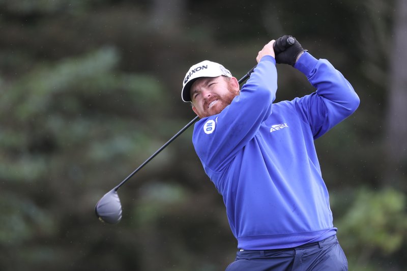The Associated Press TAKING THE LEAD: J.B. Holmes of the United States plays his tee shot on the 5th hole Thursday during the first round of the British Open at Royal Portrush in Northern Ireland.