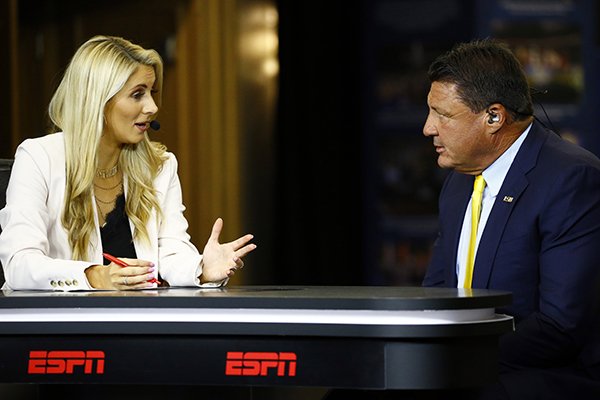 ESPN's Laura Rutlegde interviews Head Coach Ed Orgeron, of LSU, during the NCAA college football Southeastern Conference Media Days, Monday, July 15, 2019, in Hoover, Ala. (AP Photo/Butch Dill)