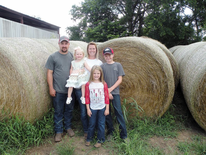 The Dustin Walker family of Ola is the 2019 Yell County Farm Family of the Year. The family includes Dustin and his wife, Melanie, and their children: Brylee, 2, Abagail, 7, and Tyler, 11. Dustin bales hay for use on the family farm, and he does custom hay-baling.