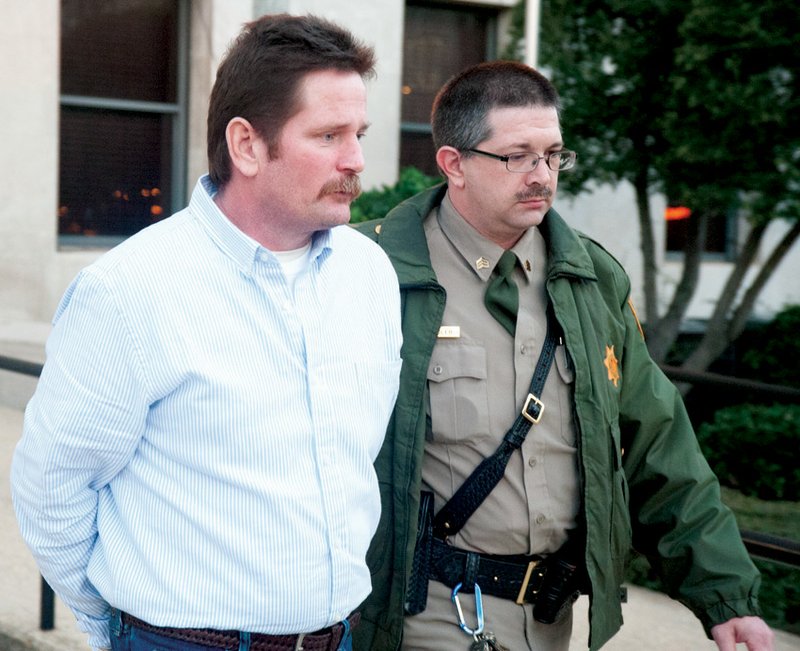 Richard Eli Hart is escorted from the Union County Courthouse in 2013 by a sheriff’s deputy following his conviction on a manslaughter charge in connection with the June 15, 2012 shooting death of Amanda Fory. News-Times file photo