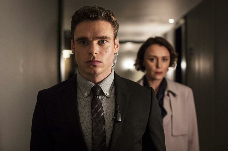 Richard Madden and Keeley Hawes are shown in a scene from Bodyguard, a series streamed by Netflix, which reported this week that it had lost 126,000 paid subscribers in the second quarter. 