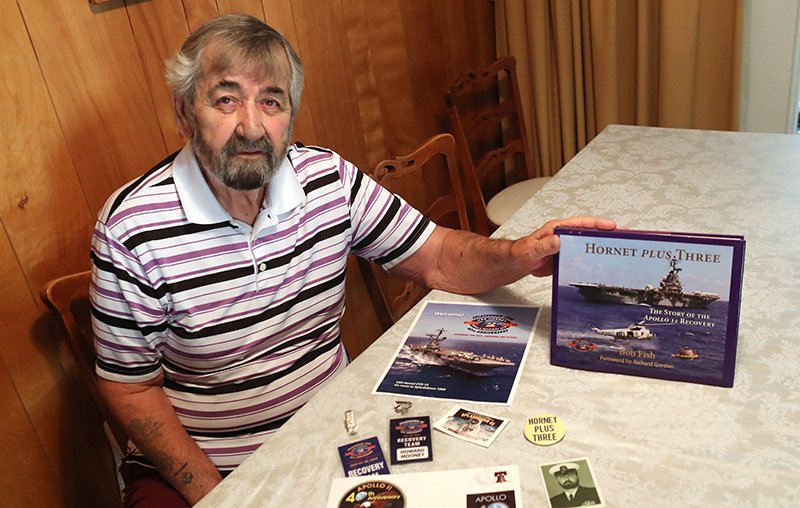 The Sentinel-Record/Richard Rasmussen PIECES OF HISTORY: Howard Mooney, of Hot Springs, displays some recovery team memorabilia ahead of the 50th anniversary of the splashdown of Apollo 11. Mooney served on the USS Hornet as senior quartermaster on the enlisted side and was part of the recovery team when Apollo 11 splashed down in 1969.