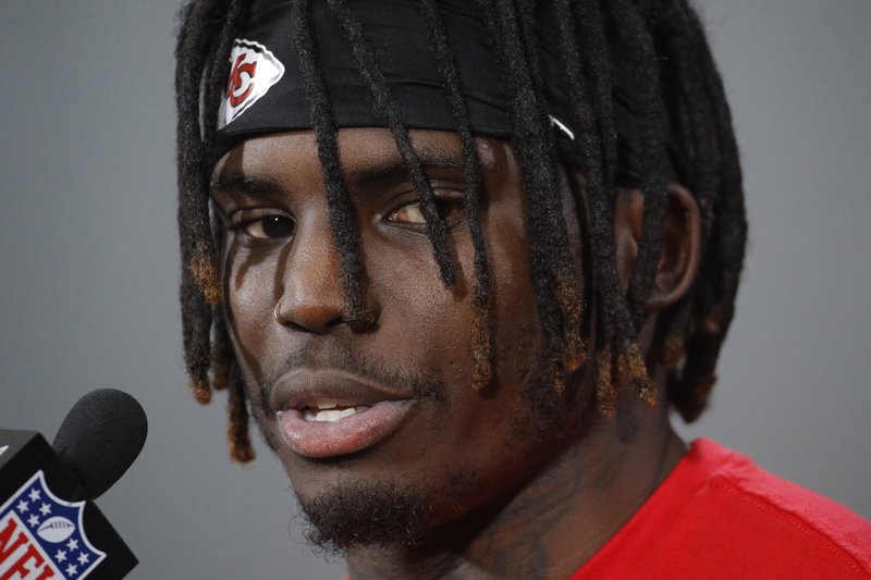FILE - In this Jan. 18, 2019, file photo, Kansas City Chiefs wide receiver Tyreek Hill talks to the media after a workout in Kansas City, Mo. The NFL will not suspend Chiefs wide receiver Tyreek Hill under its personal conduct policy after the league investigating his involvement in a domestic violence incident involving his 3-year-old son. The league said in a statement Friday, July 19, 2019, that it has not been given access to information in the court proceedings, and a district attorney in June said an investigation was dropped because officials couldn't prove who injured the boy. (AP Photo/Charlie Riedel, File)