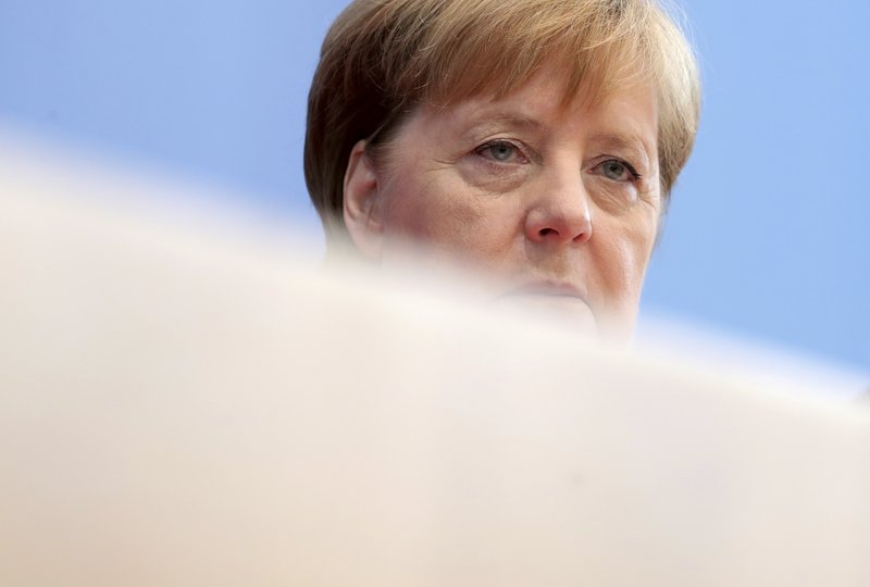 German Chancellor Angela Merkel attends her annual sommer press conference in Berlin, Germany, Friday, July 19, 2019. (AP Photo/Michael Sohn)