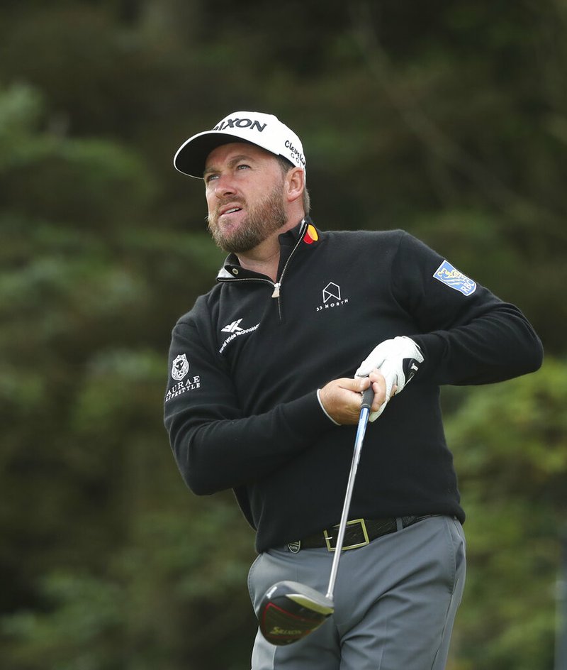 The Associated Press
NATIVE SON:
Northern Ireland's Graeme McDowell reacts after hitting his shot on the 5th tee Thursday during the first round of the British Open Golf Championships at Royal Portrush in Northern Ireland.