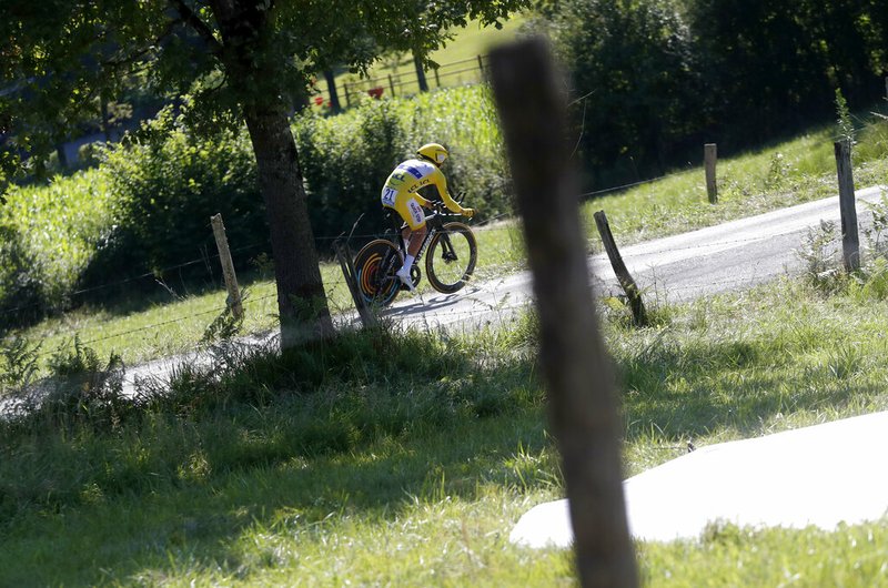 The Associated Press
LEADING THE PACK:
France's Julian Alaphilippe, wearing the overall leader's yellow jersey, rides Friday during the thirteenth stage of the Tour de France, an individual time trial over 27.2 kilometers (16.9 miles) with start and finish in Pau, France.