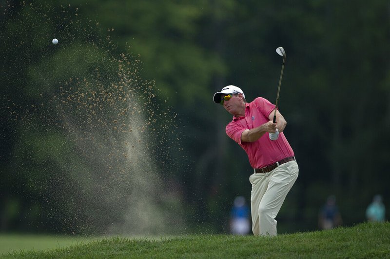 The Associated Press
A LITTLE HELP:
Jim Herman hits the ball from a bunker on the 18th hole Friday during the second round of the Barbasol Championship at Keene Trace Golf Club in Nicholasville, Ky.