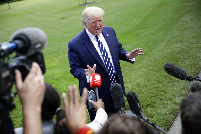 President Donald Trump speaks to members of the media before boarding Marine One helicopter on the South Lawn of the White House in Washington, for the short flight to nearby Andrews Air Force Base, Md., Friday, July 19, 2019. (AP Photo/Pablo Martinez Monsivais)